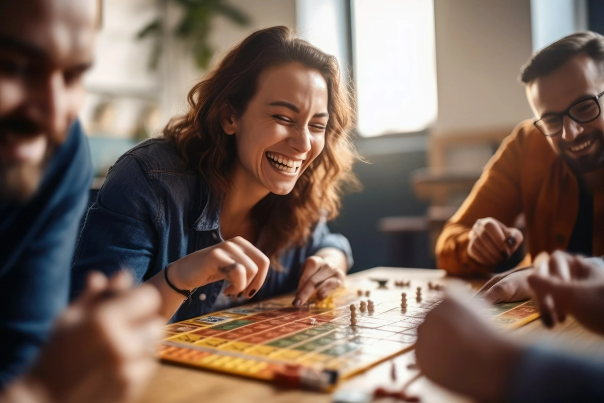 People happy playing a board game